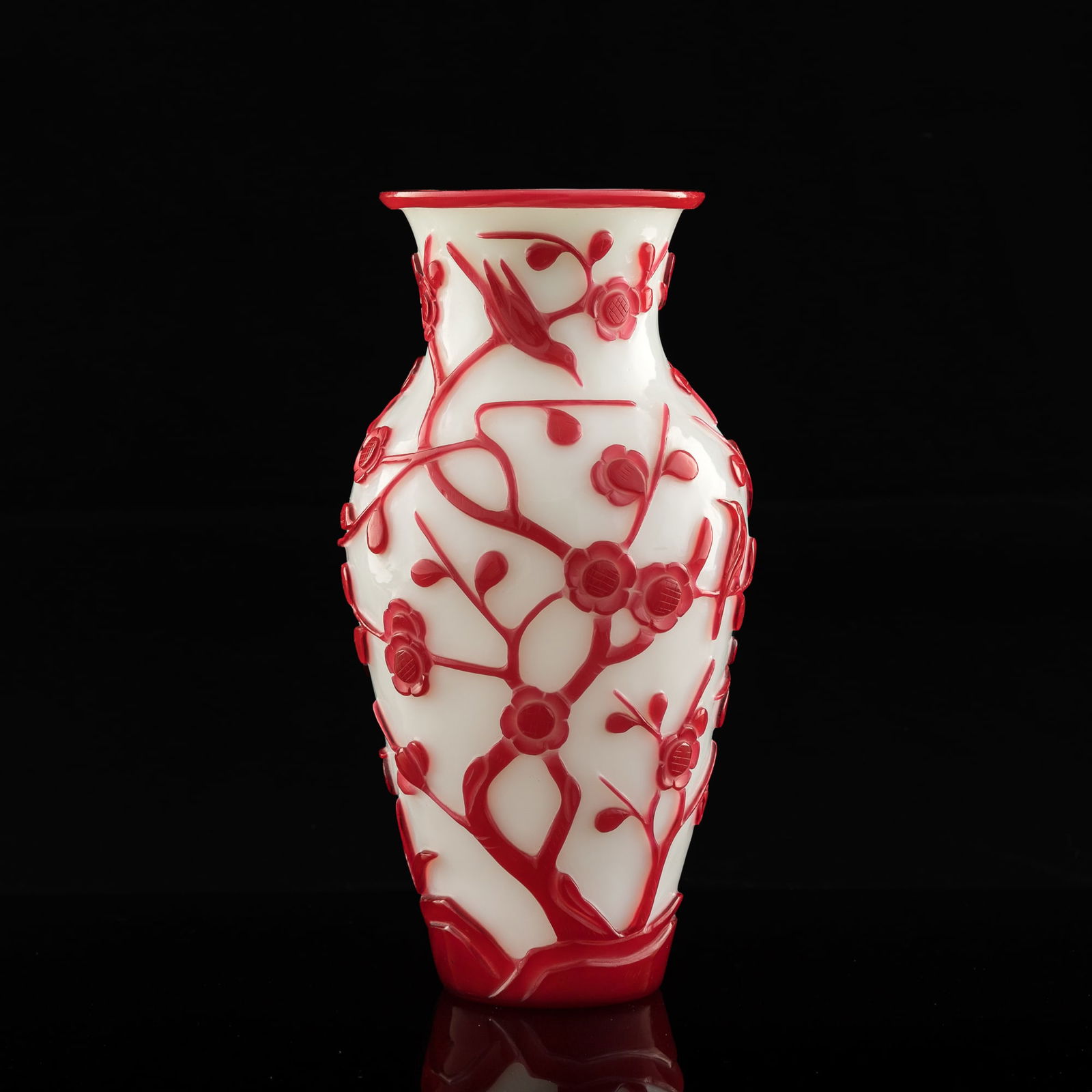 A Chinese red-overlay white glass vase, 19th century: A Chinese red-overlay white glass vase19th centuryDecorated with flowers and birds to body.H: 10, Dia: 5 3/8 in. (H: 25.4, Dia: 13.7 cm.)Private collection, Southern California. Click here for high