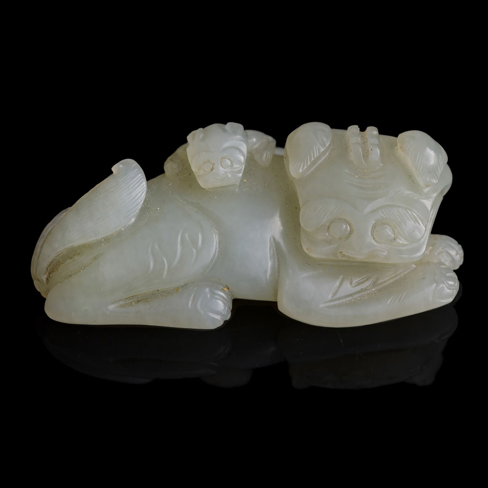 A Chinese jade lion-form pendant, Ming dynasty (1 of 8)