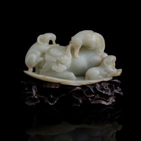 A Chinese white jade ornament of three goats, 19th century