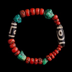 A Chinese bracelet with Dzi bead, coral and turquoise, Qing dynasty or earlier
