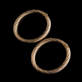 A pair of 14K gold Italian hollow bangles