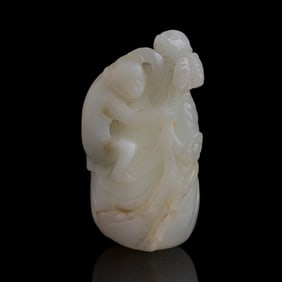 A Chinese white jade 'monkey' pendant, early 19th century