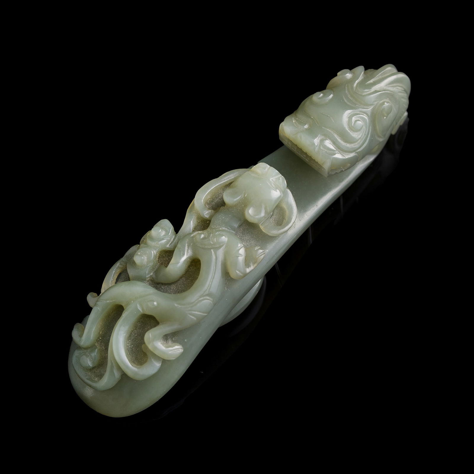 A Chinese celadon jade dragon hook, 18th century (1 of 7)