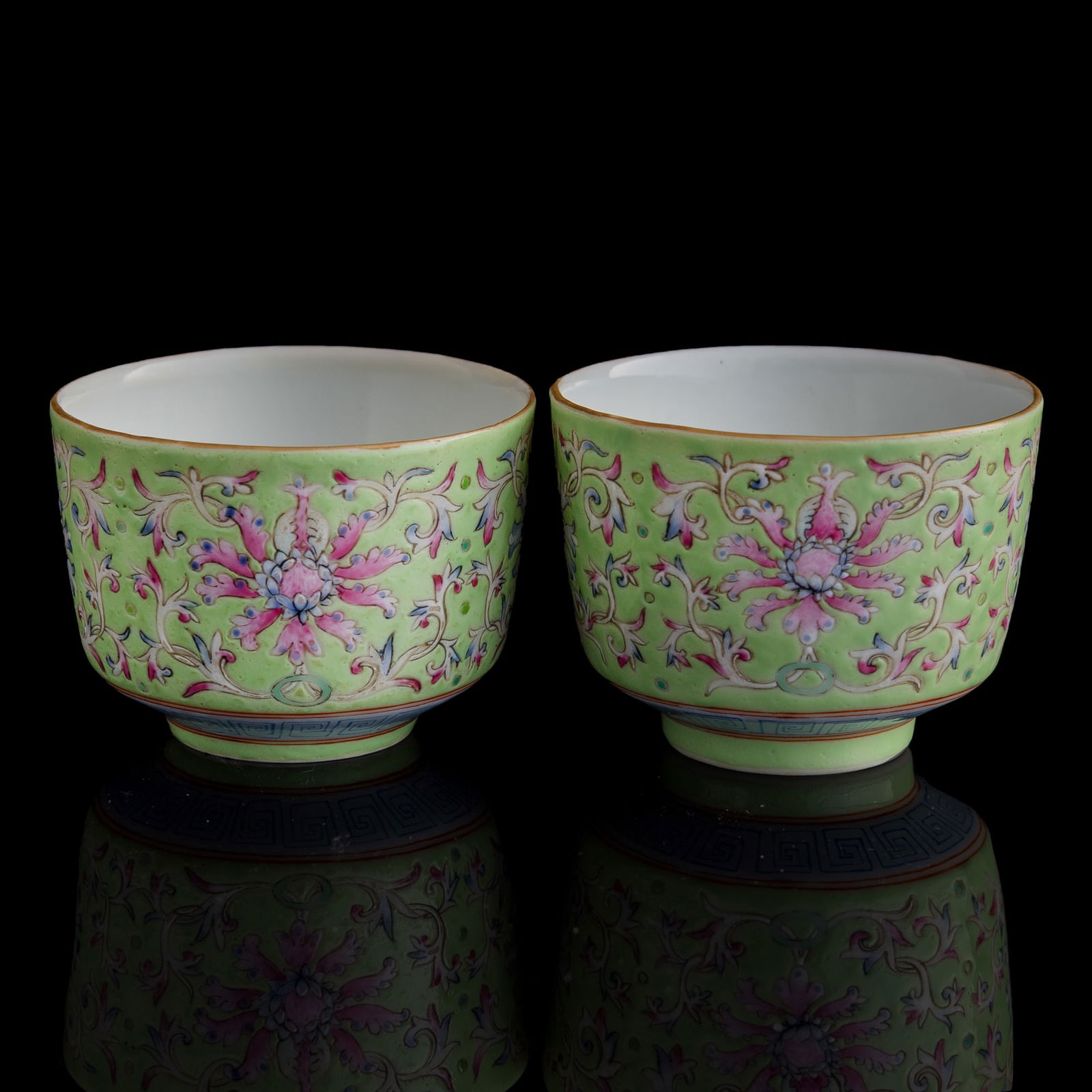 A pair of Chinese green-ground famille rose 'floral scrolls' cups, Republic period (1 of 11)