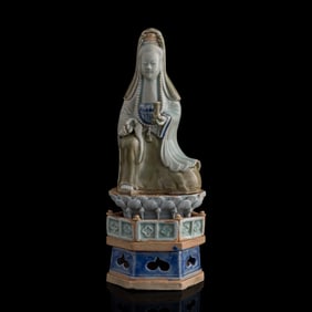 A Chinese carved porcelain figure of Guanyin, 17th century