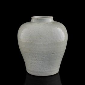 A Chinese white-glazed incised 'floral scrolls' jar, Ming dynasty