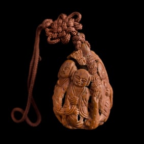 A Chinese carved pit 'Luohan' pendant, Republic period or later