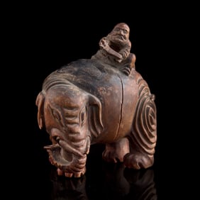 A Chinese wood carving of foreigner riding elephant, Qing dynasty