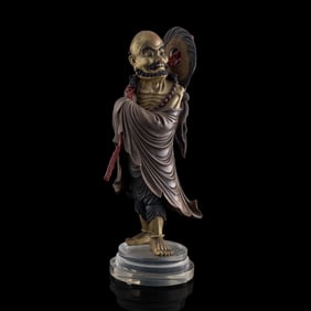 A Chinese lacquered wood figure of Bodhidharma, late 19th century