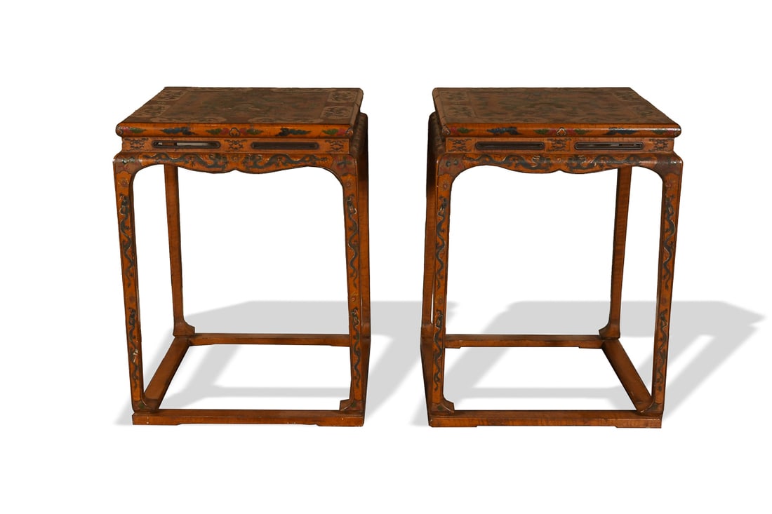 A pair of Chinese lacquered side tables, Ming dynasty: A pair of Chinese lacquered side tables Ming dynasty Each table of square form, the top painted in polychrome depicting a frontal five-clawed dragon holding aloft a tray with its forelegs, the tray be