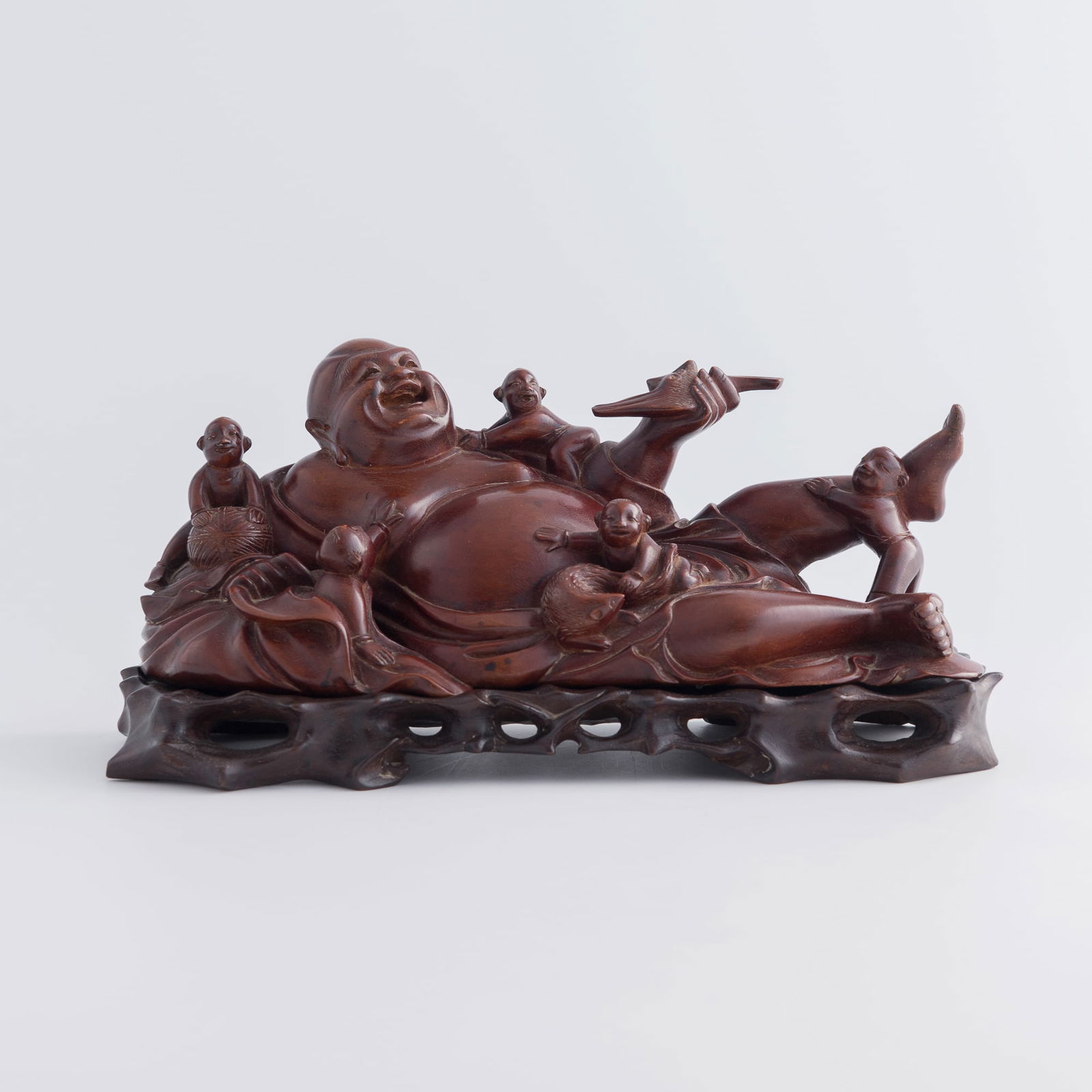 A Chinese longan wood figure of Buddha and boys, late 19th century (1 of 10)