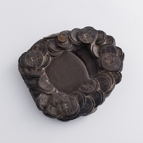 A Chinese 'coin' inkstone, Qing dynasty