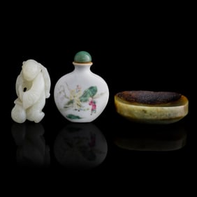 Two Chinese jades and a famille rose snuff bottle, 19th century