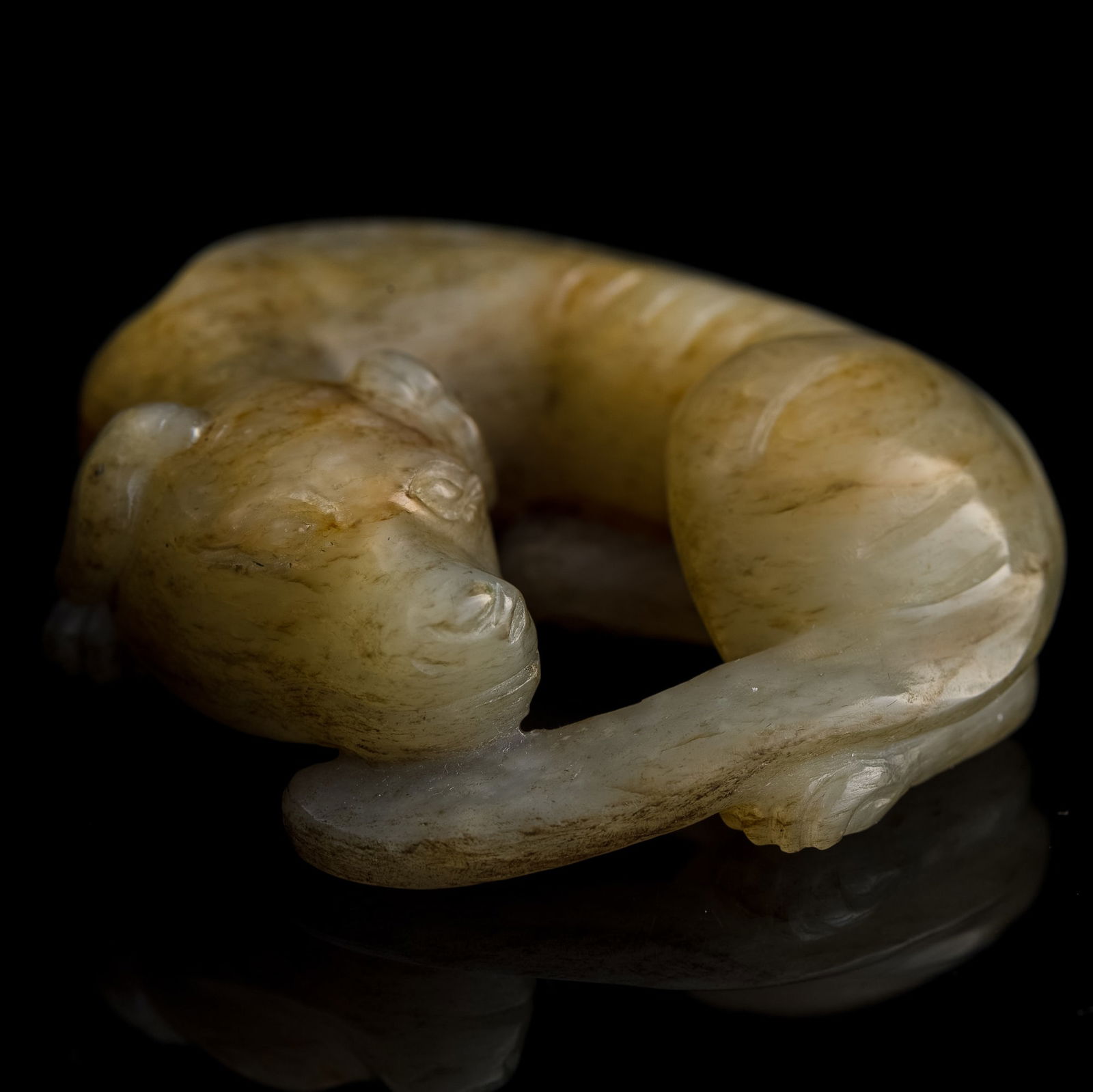 A Chinese jade recumbent dog, Ming dynasty or earlier (1 of 7)