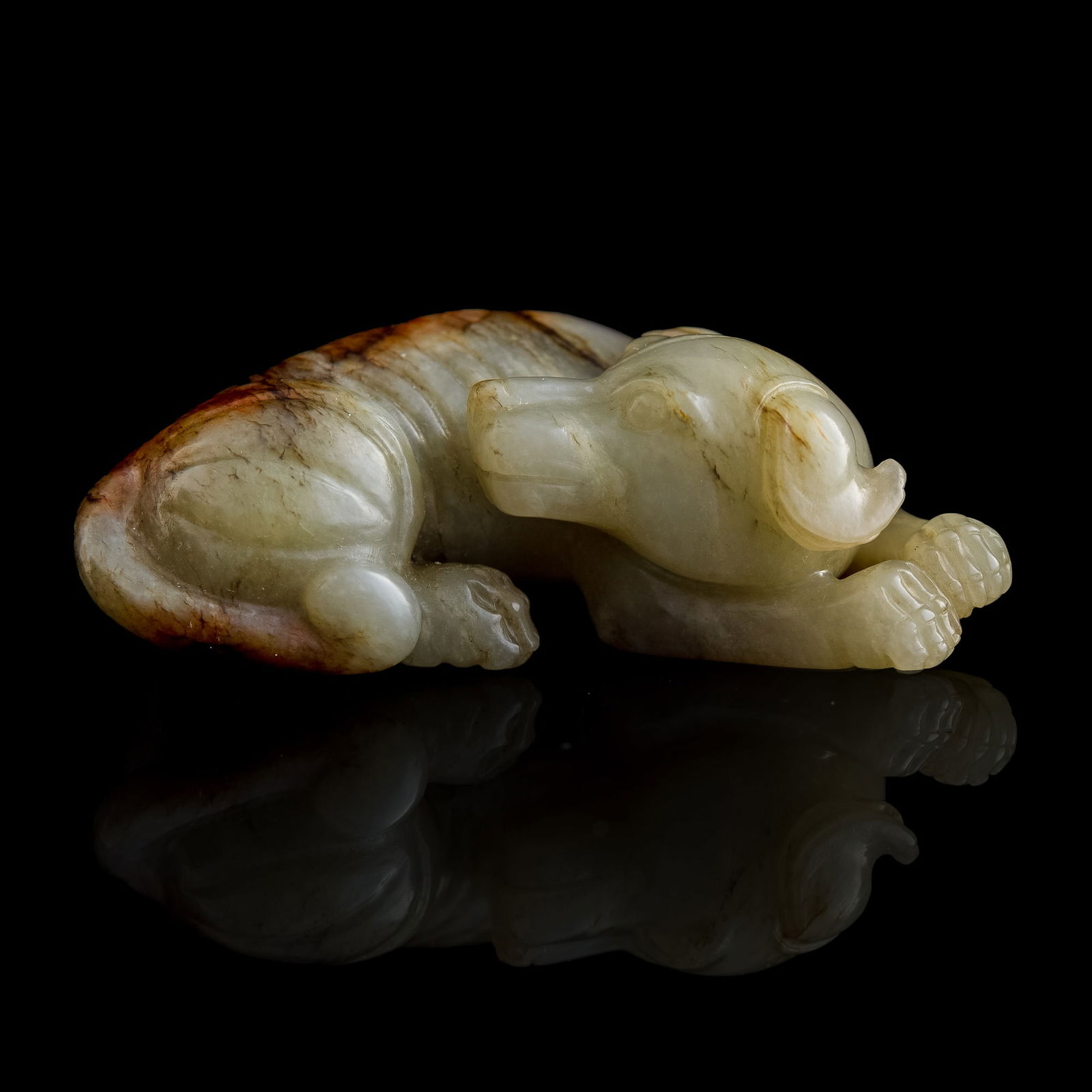 A Chinese jade recumbent dog, Ming dynasty or earlier (1 of 7)