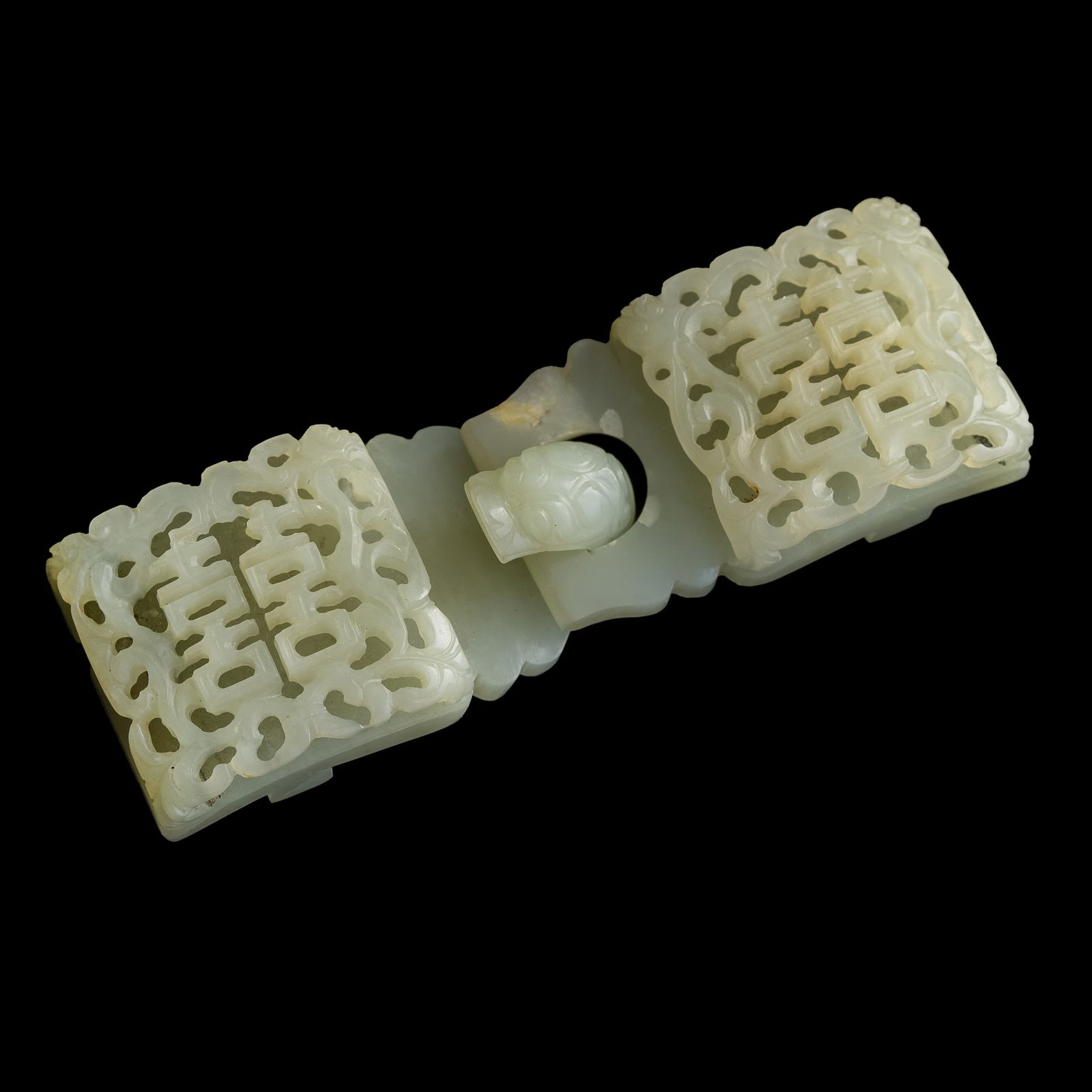 A Chinese reticulated white jade 'double happiness' belt buckle, 18th century (1 of 7)