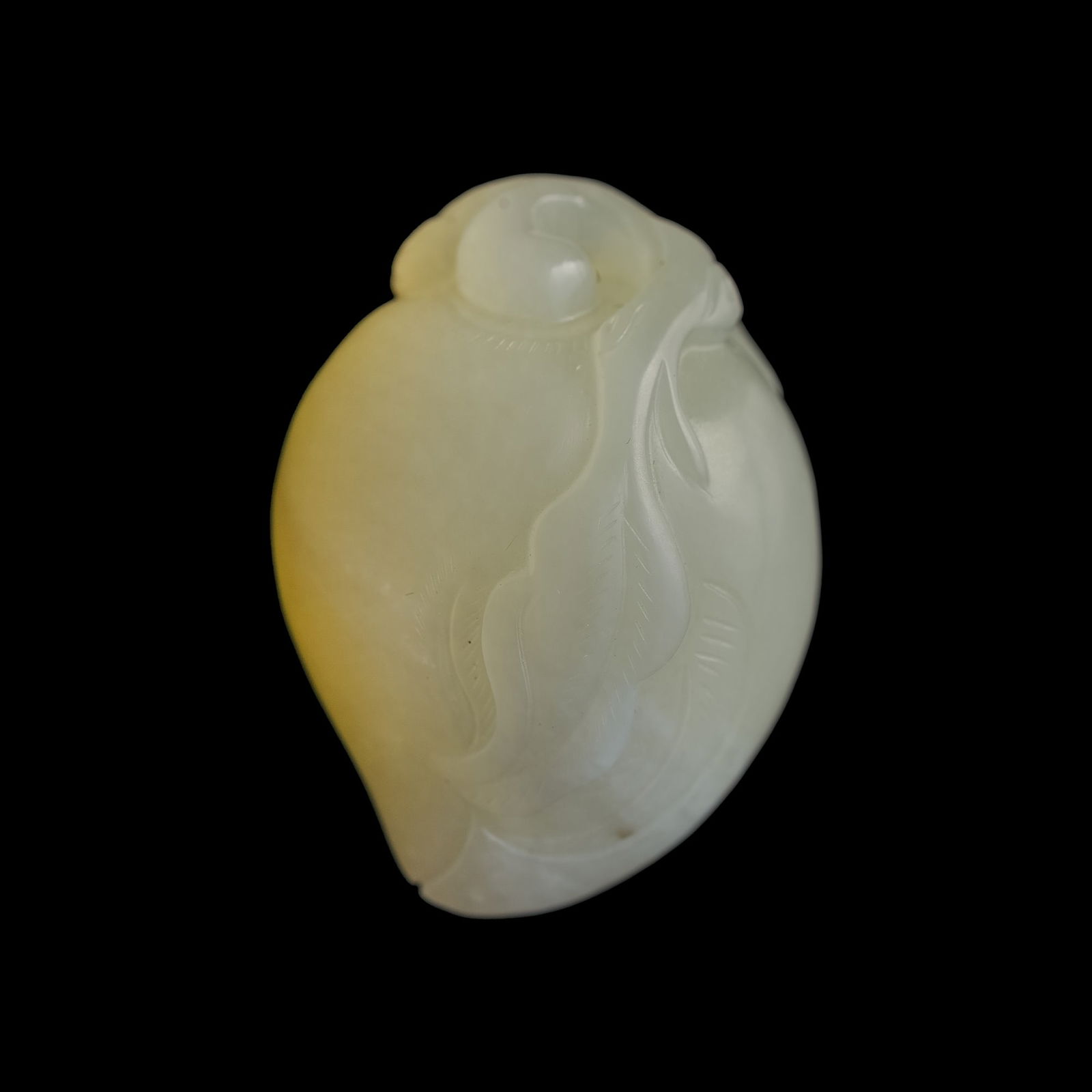A Chinese white jade pendant of a longevity peach, 18th century (1 of 6)