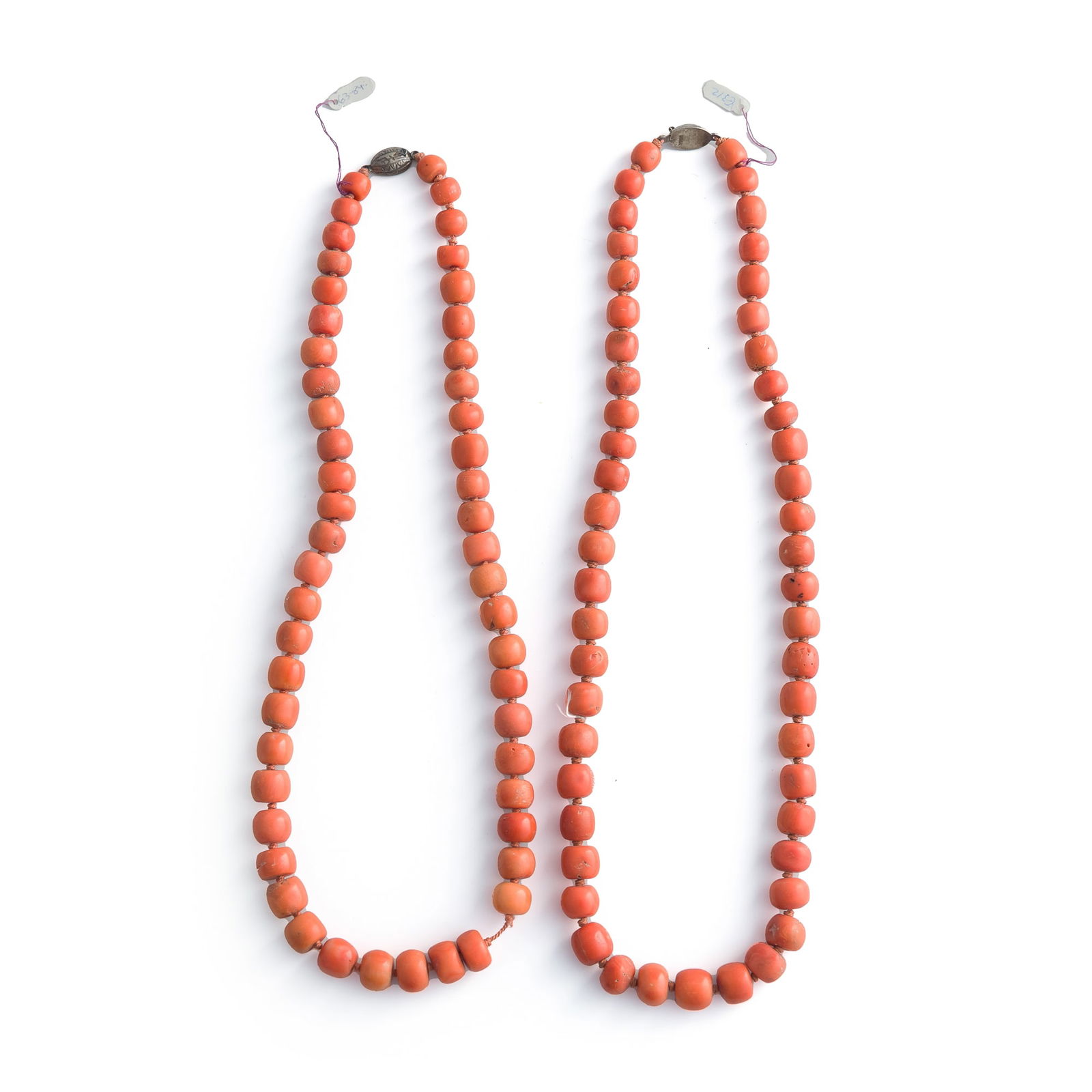 Two Chinese coral necklaces: Two Chinese coral necklaces Each with "SILVER" mark to clasp. (2). Length 1: 12 in. (30.5 cm.); Length 2: 11 1/2 in. (29.2 cm.) Bead Diameter 1: 9.7-13.7 mm.; Bead Diameter 2: 9.6-13.8 mm. Weight 1: 1