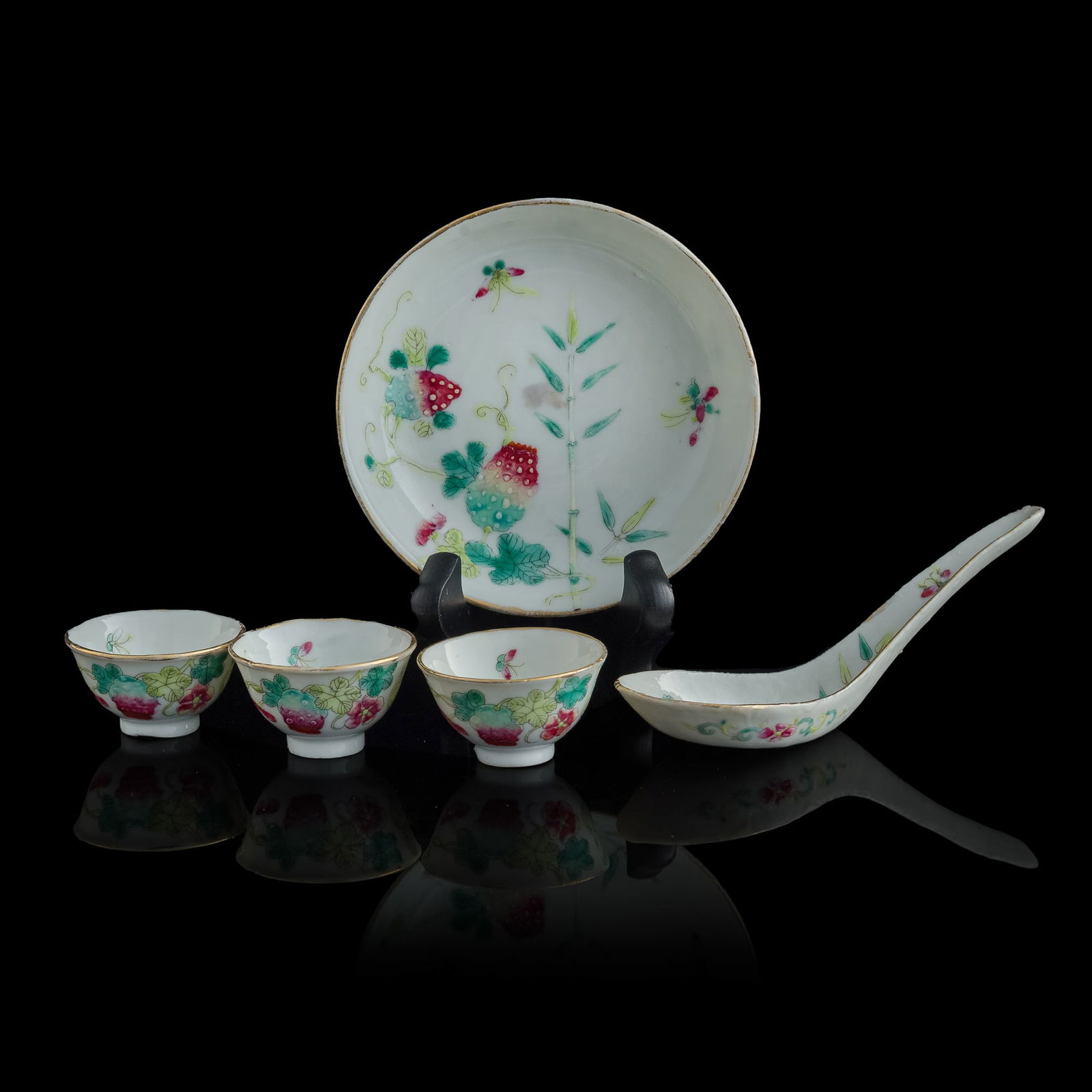 A set of three Chinese famille rose cups, a spoon and a dish, Xuantong period, Qing dynasty (1 of 10)
