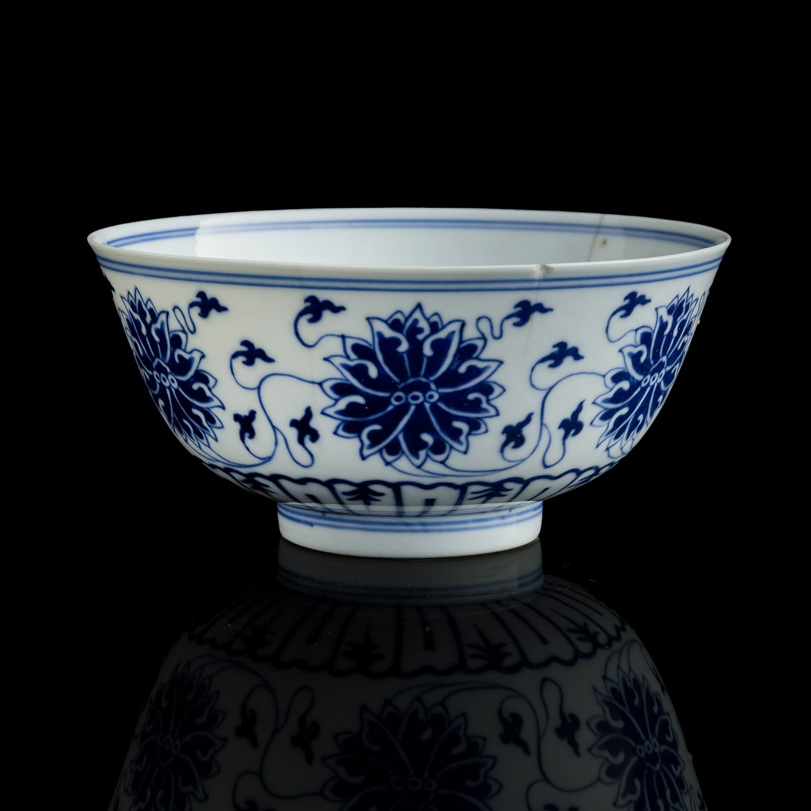 A Chinese blue and white 'scrolling lotus' bowl, Xuantong period, Qing dynasty (1 of 9)
