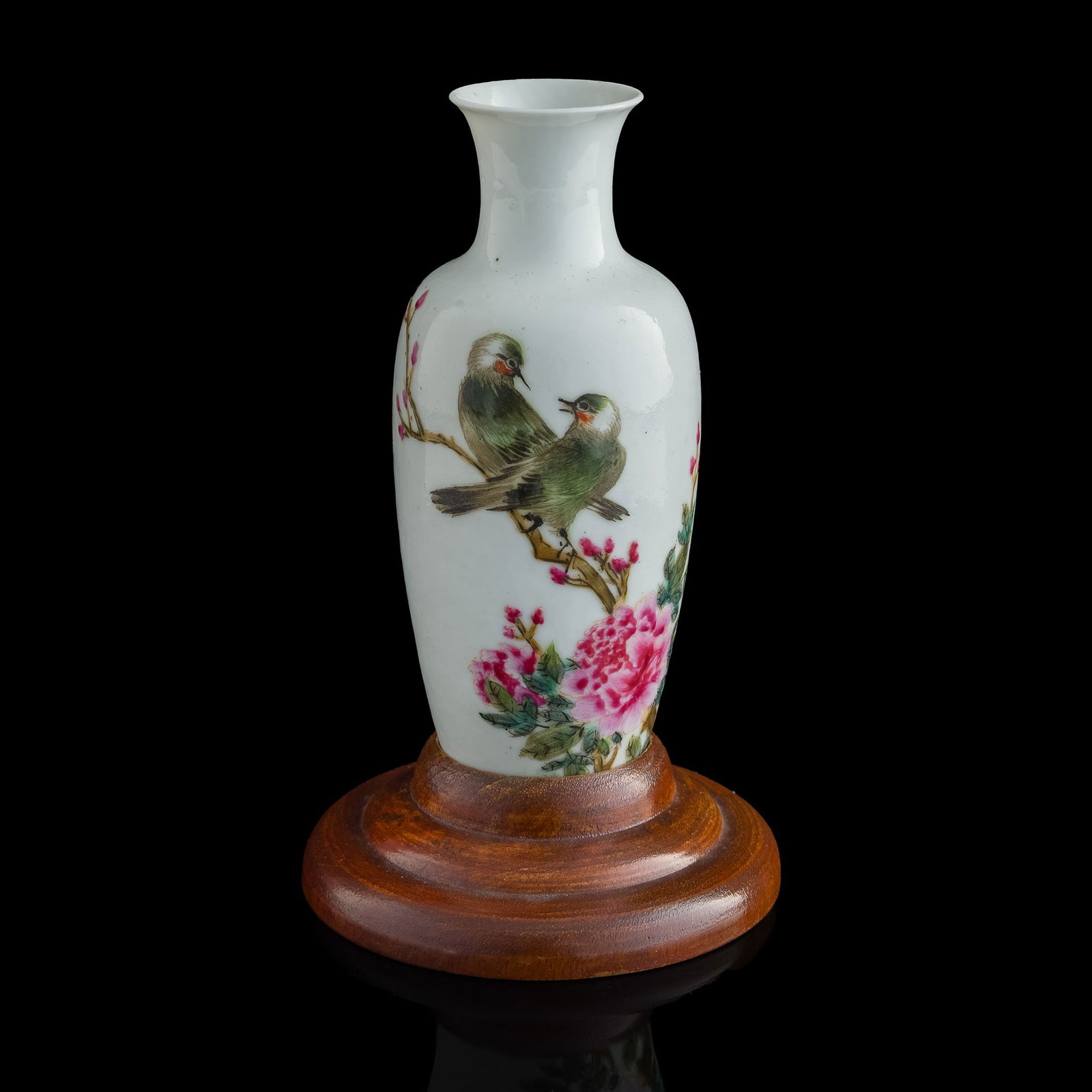 A Chinese famille rose 'flower and bird' vase, Republic period: A Chinese famille rose 'flower and bird' vase Republic period With a mark to underside. Sold with associated wooden stand. H: 6 1/2, Dia: 2 3/4 in. (H: 16.5, Dia: 7 cm. (vase)) Private collection, Mal
