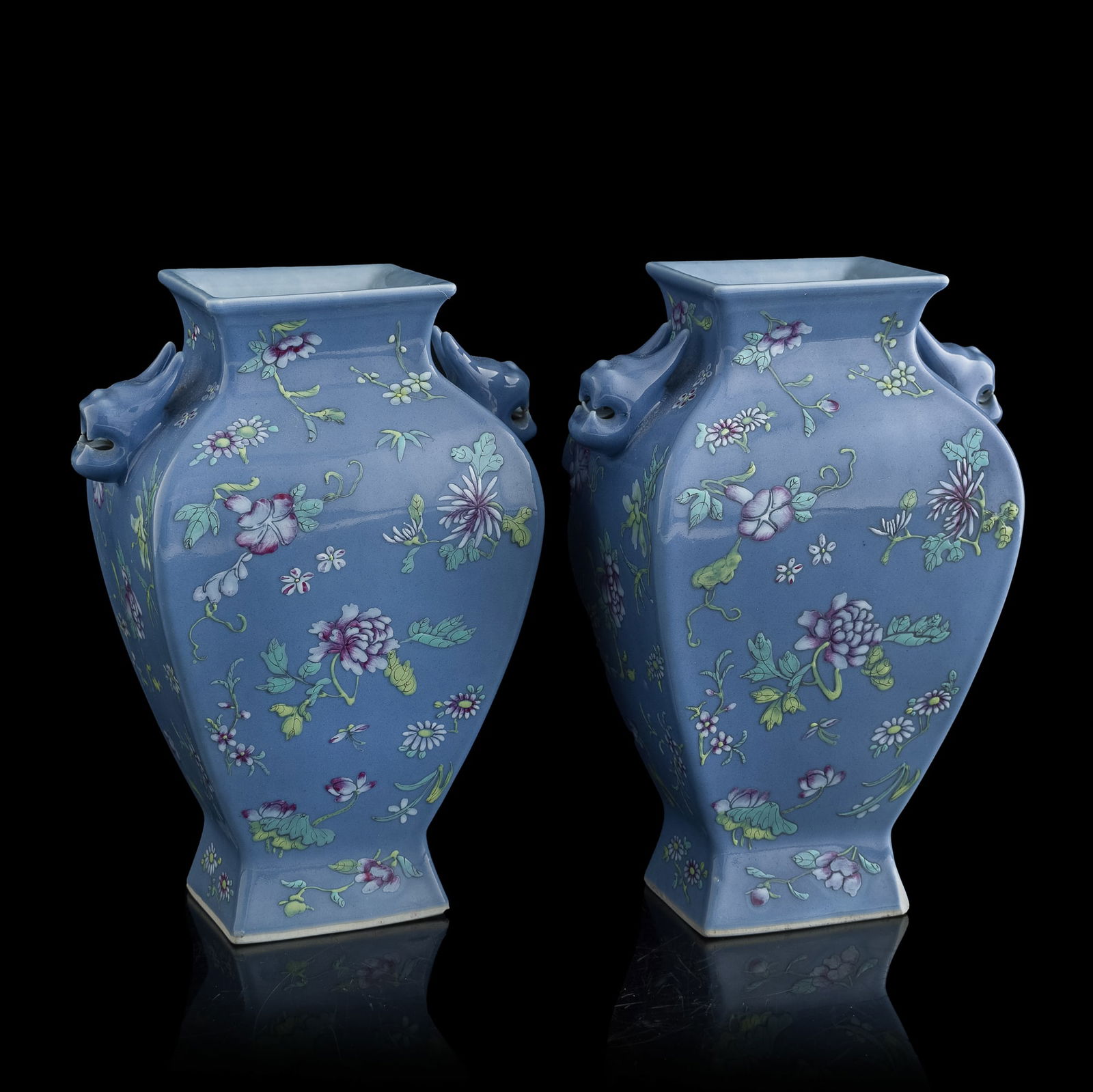 A pair of Chinese blue-ground famille rose vases with beast-form handles, Republic period: A pair of Chinese blue-ground famille rose vases with beast-form handles Republic period H: 9 7/8, W: 7 1/2, D: 4 3/4 in. (H: 25.1, W: 19.1, D: 12.1 cm. (each)) From Ms. Maedo in Honolulu, Hawaii.