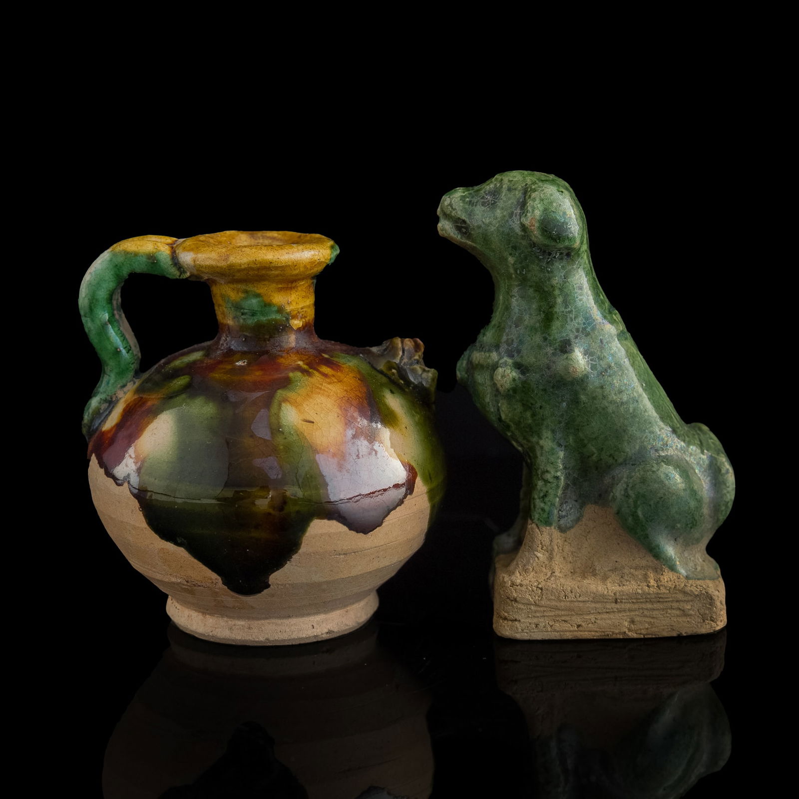 A Chinese sancai ewer and a beast, Tang dynasty: A Chinese sancai ewer and a beastTang dynastyH: 2 3/4, W: 1 3/4, D: 1 1/4 in. (H: 7, W: 4.4, D: 3.2 cm. (beast))From Dr. Lau, Honolulu, Hawaii. Acquired in Hong Kong in the 1970s to 1990s.Click here