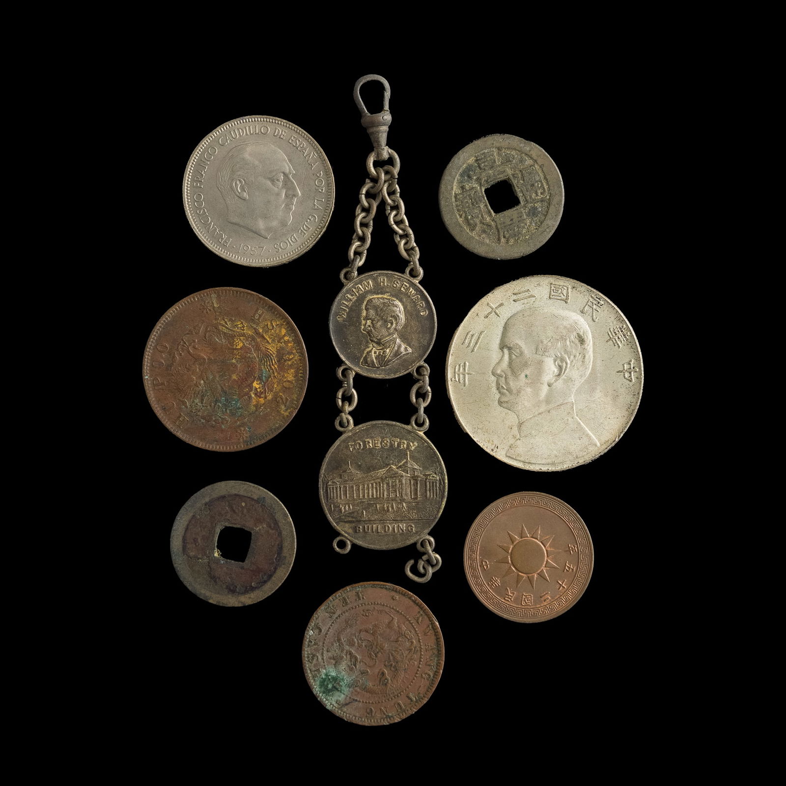 Nine assorted Chinese and foreign coins: Nine assorted Chinese and foreign coinsComprising: one Kaiyuan Tongbao, one Jiaqing Tongbao, two Guangxu Yuanbao, one Year 23 Republic silver dollar (1934), one Year 25 Republic one-cent copper coin