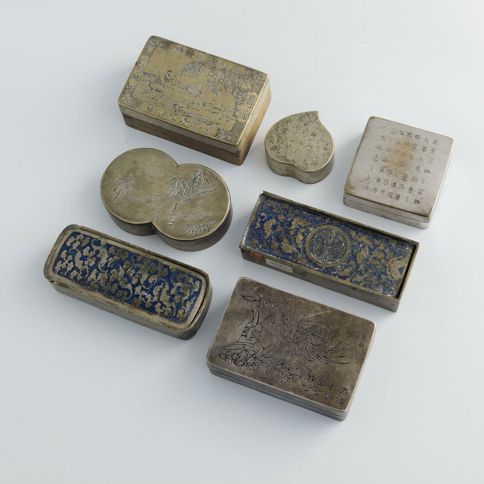 Seven Chinese bronze ink boxes, late 19th/early 20th century: Seven Chinese bronze ink boxeslate 19th/early 20th centuryH: 1 5/8, W: 4 1/2, D: 3 in. (H: 4.1, W: 11.4, D: 7.6 cm. (largest))Weight: 2062 g (overall)From an estate in Oregon.Click here for high