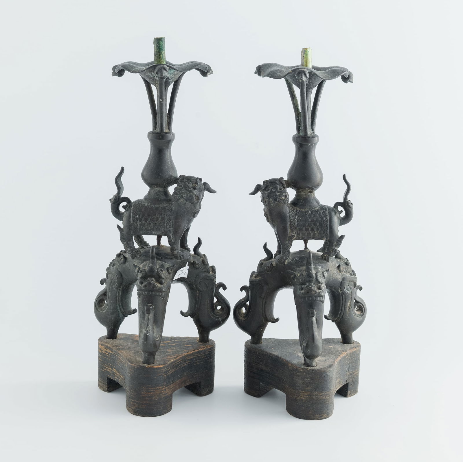 A pair of Chinese bronze beast-form tripod candlesticks, Ming dynasty (1 of 11)