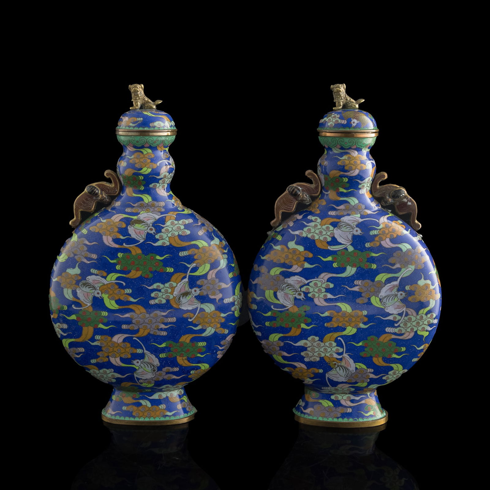 A pair of Chinese cloisonne 'bats and clouds' moonflasks, late 19th century: A pair of Chinese cloisonne 'bats and clouds' moonflaskslate 19th centuryEach with "CHINA" mark to underside. (2).H: 15 3/4, W: 9, D: 3 3/4 in. (H: 40, W: 22.9, D: 9.5 cm. (each))Private collection,