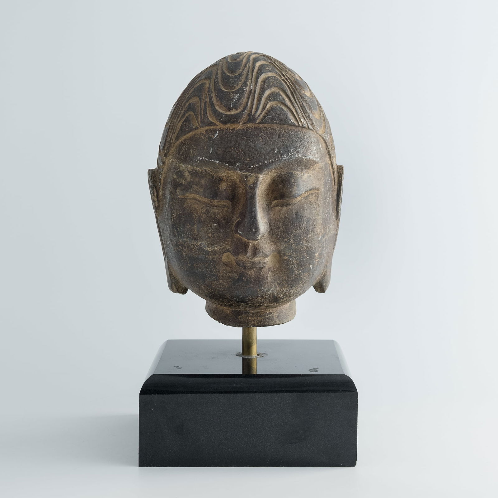 A Chinese carved stone Buddha head, Qing dynasty or earlier (1 of 9)