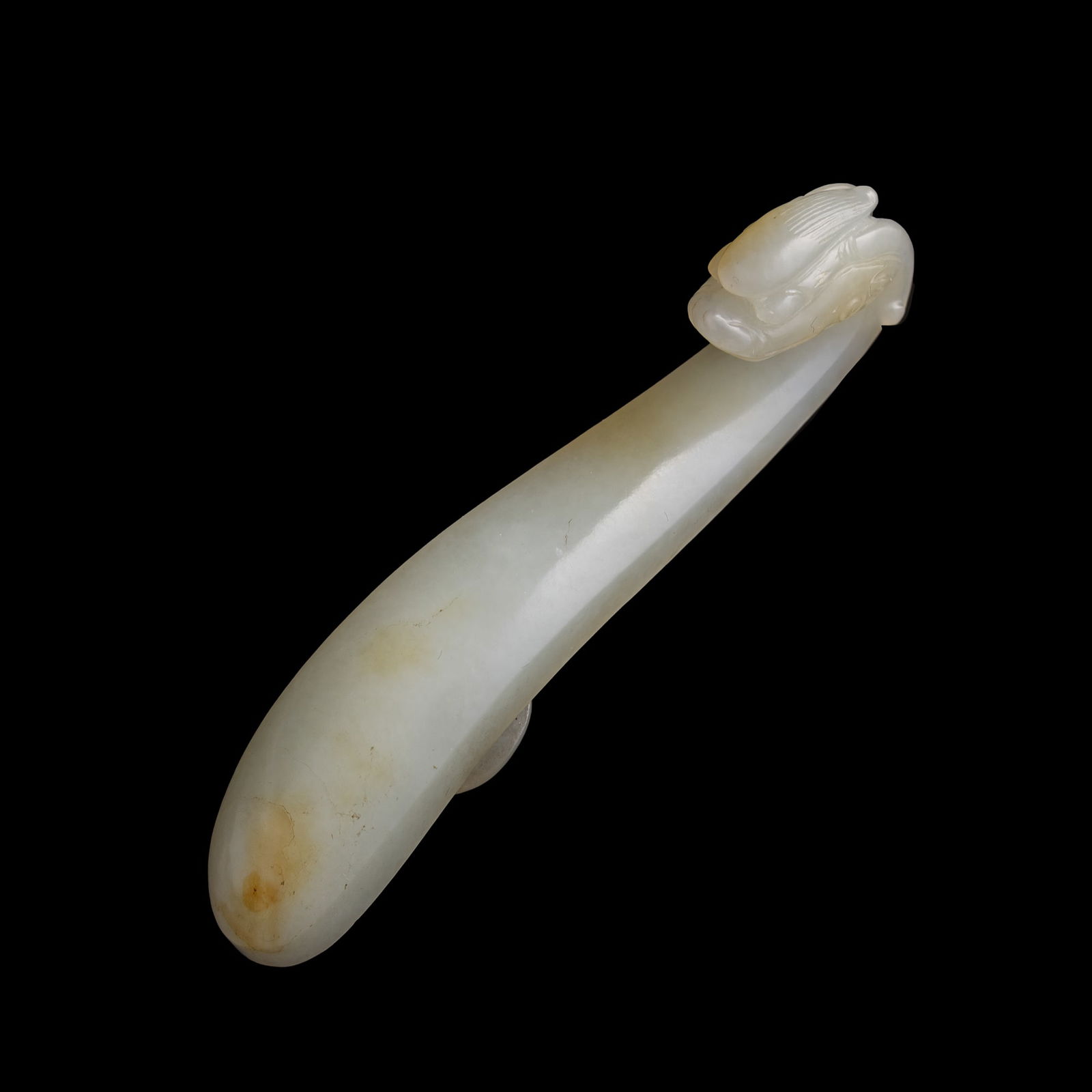 A Chinese white jade dragon hook, Ming dynasty (1 of 8)