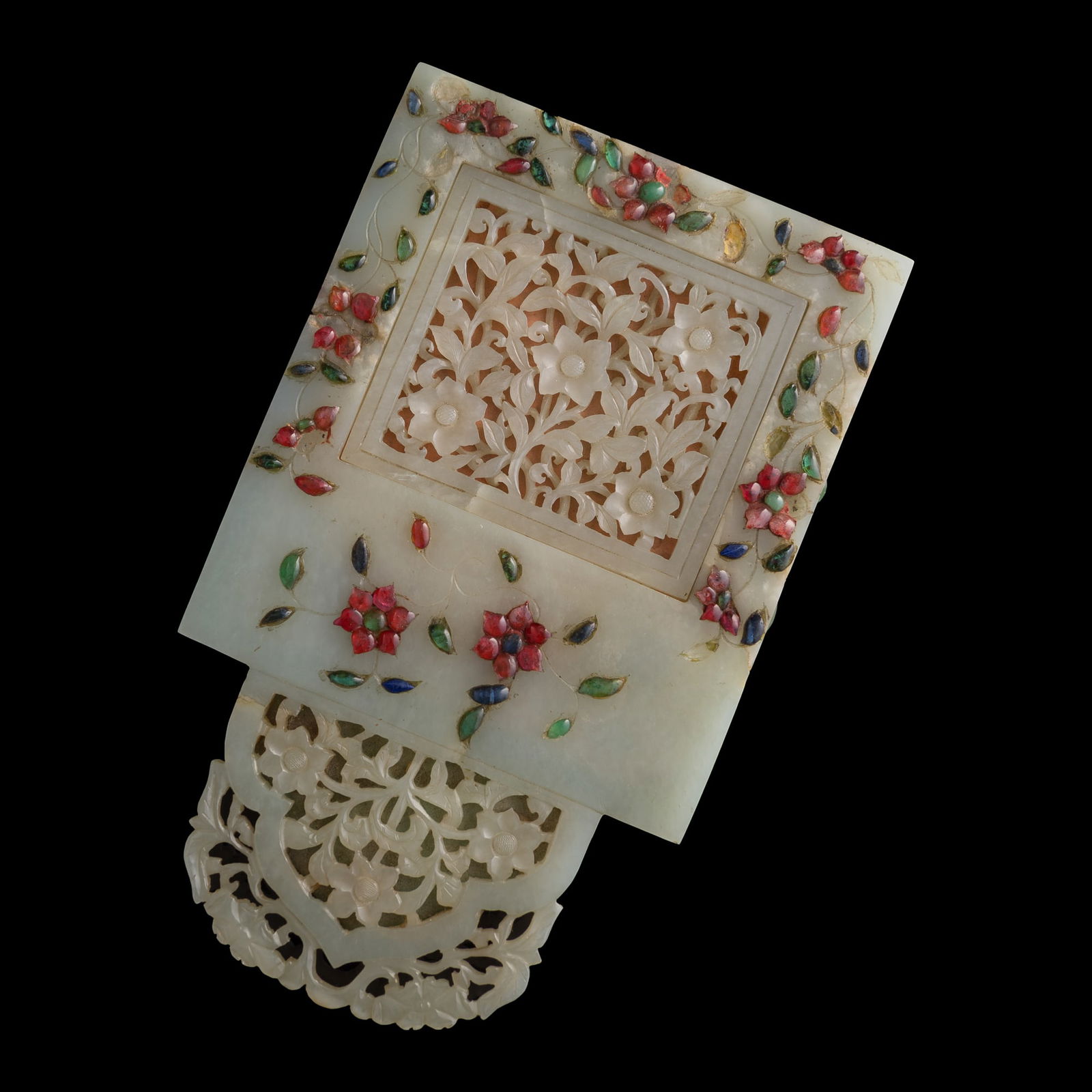 A Chinese reticulated white jade mirror inset with hardstone, 18th century: A Chinese reticulated white jade mirror inset with hardstone 18th century H: 8 1/4, W: 5, D: 1/2 in. (H: 21, W: 12.7, D: 1.3 cm.) Private collection, Malvern, Pennsylvania.