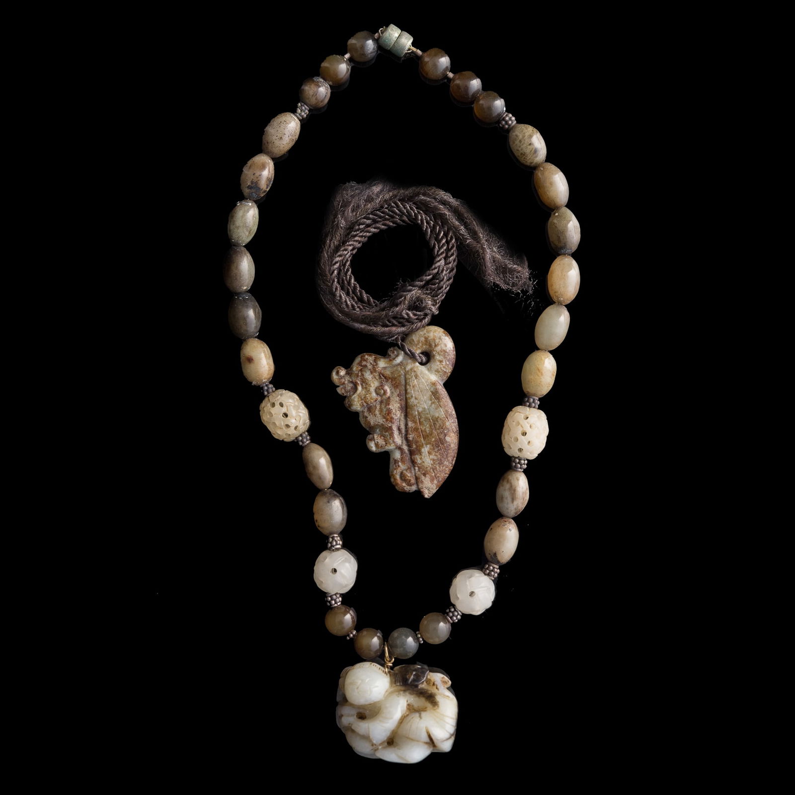 A Chinese jade necklace with a boy figure and an auspicious beast pendant, 18th century or earlier (1 of 9)