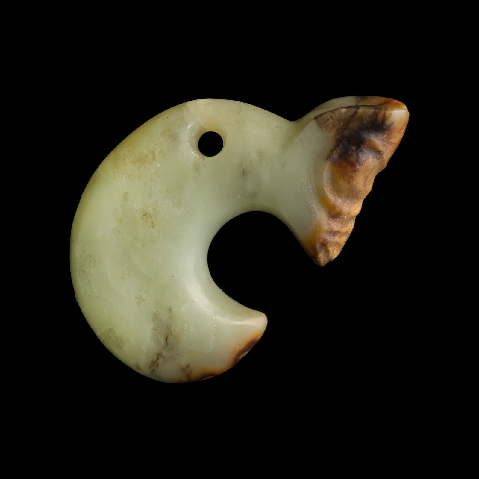 A Chinese jade pendant of pig-dragon (zhulong), Hongshan culture (possible): A Chinese jade pendant of pig-dragon (zhulong) Hongshan culture (possible) H: 1 1/2, W: 2 1/4, D: 1/2 in. (H: 3.8, W: 5.7, D: 1.3 cm.) Private estate, Northern California.