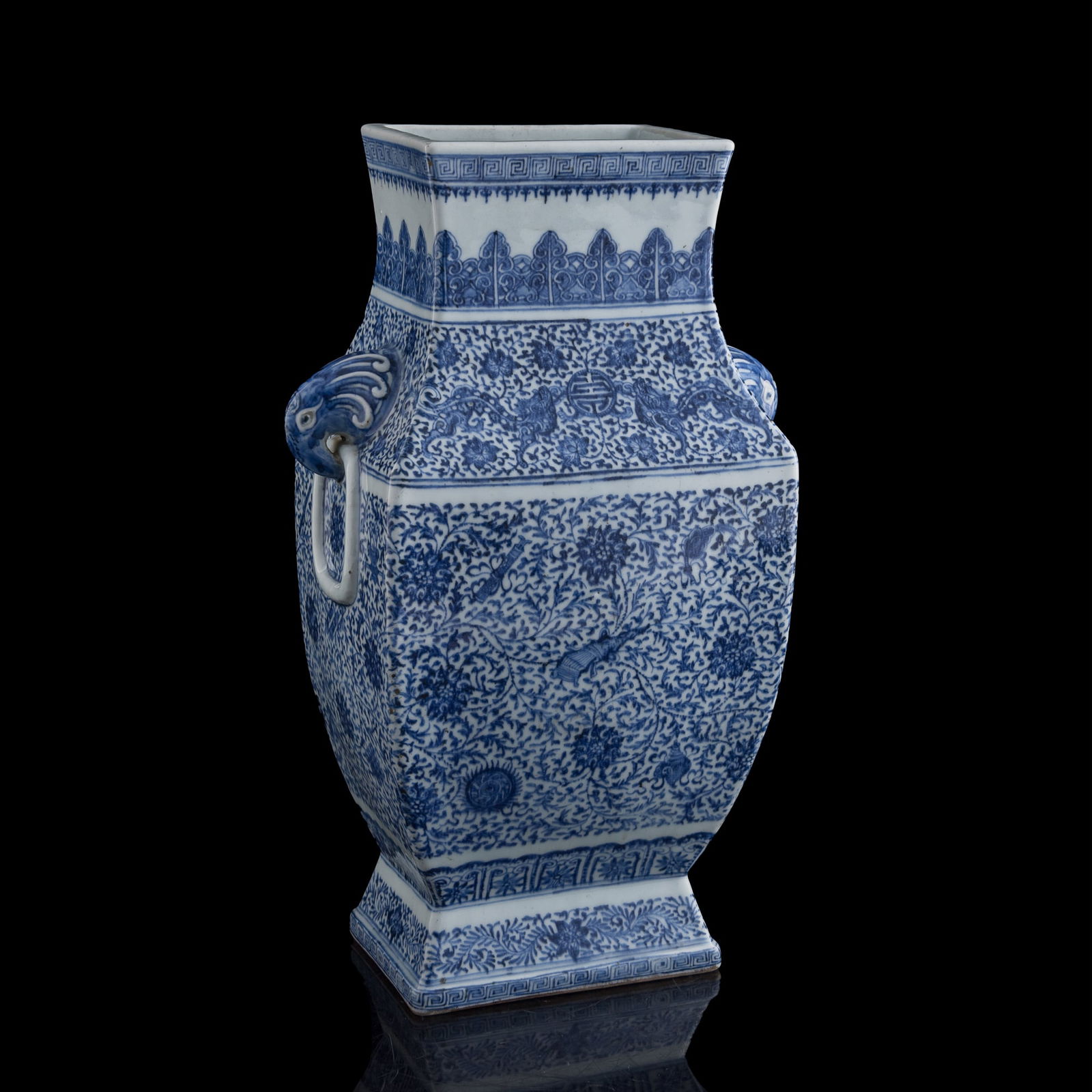 A Chinese blue and white 'scrolling lotus' and 'chilong' zun vase, Yongzheng period, Qing dynasty: A Chinese blue and white 'scrolling lotus' and 'chilong' zun vase Yongzheng period, Qing dynasty Decorated with double dove-head handles. H: 15 1/4, W: 9 1/2, D: 5 7/8 in. (H: 38.7, W: 24.1, D: 14.9 c