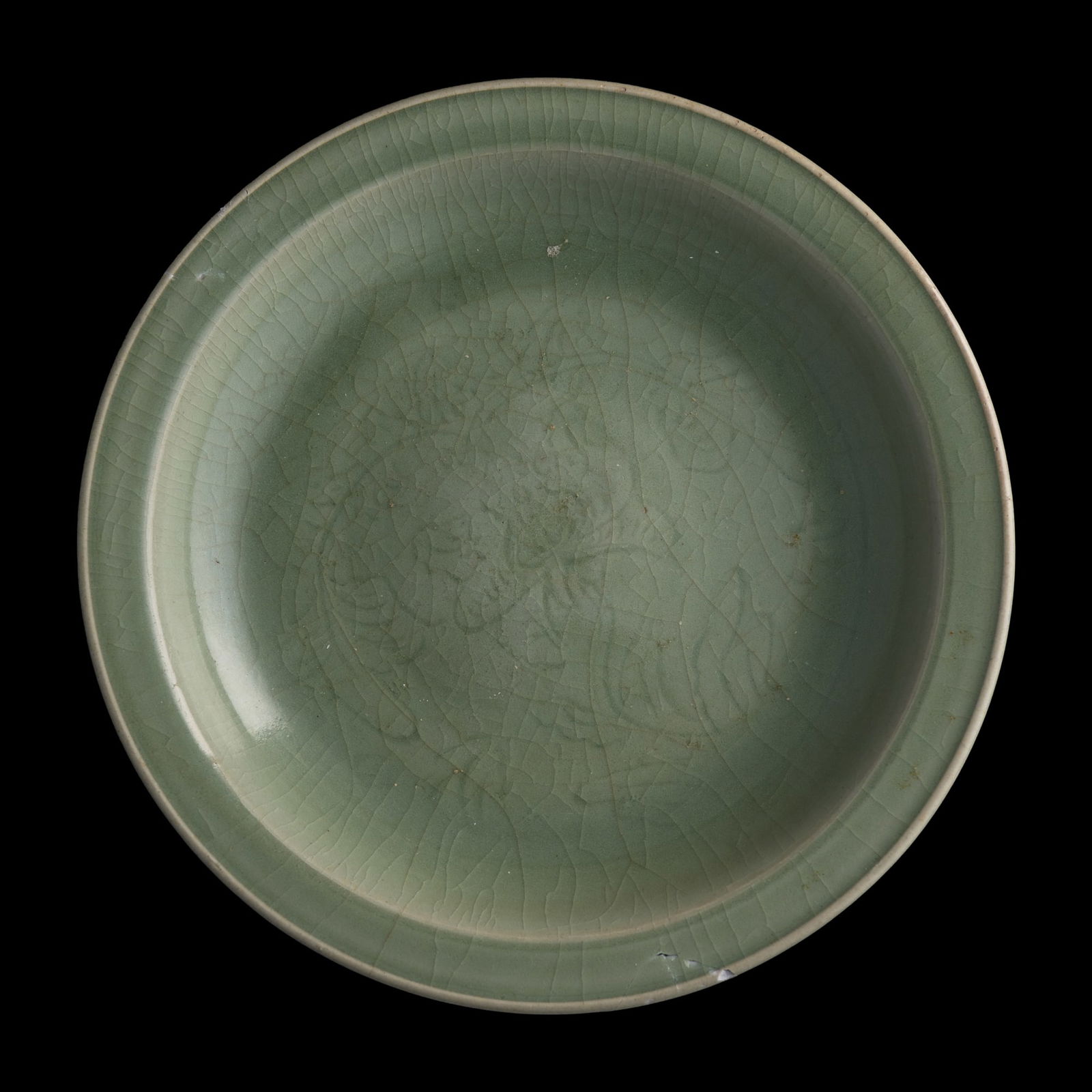 A large Chinese Longquan celadon incised plate, Yuan dynasty (1 of 5)