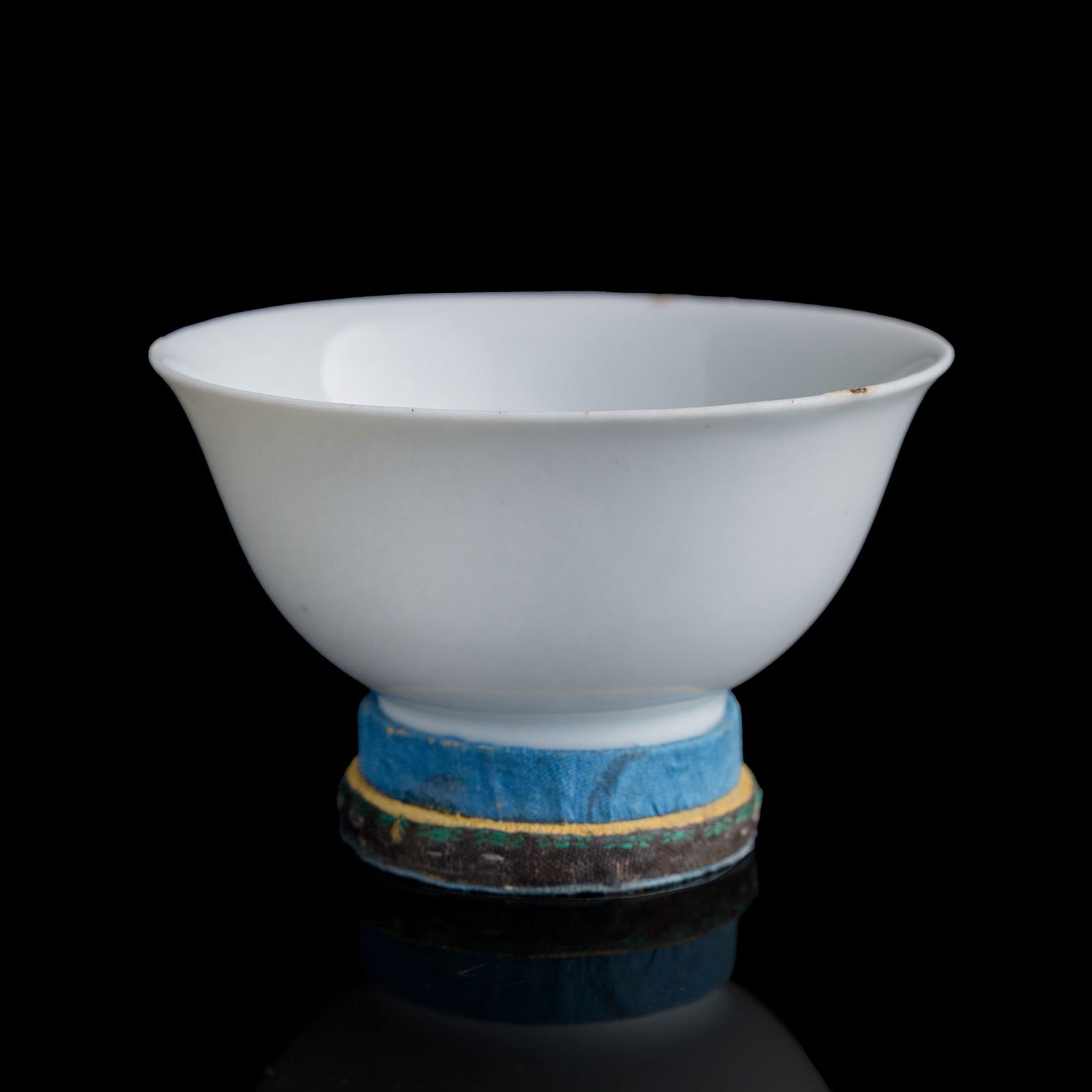 A Chinese blue and white tea bowl, 17th century: A Chinese blue and white tea bowl 17th century Decorated with a "cha" (tea) character within, and "jin lu da jiao tan yong" mark to underside. Sold with a fitted stand. H: 1 7/8, Dia: 3 5/8 in. (H: 4.
