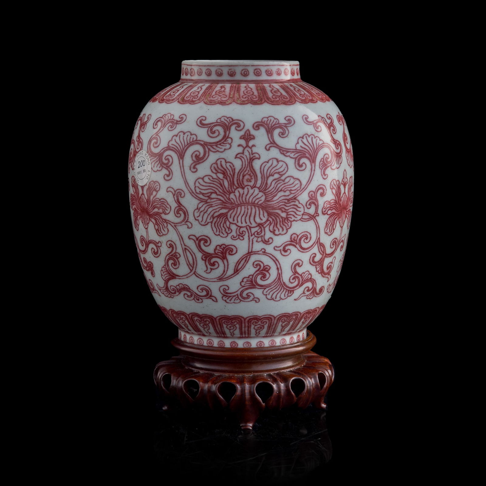 A Chinese copper-red-underglazed 'scrolling lotus' jar, Qianlong period, Qing dynasty (1 of 14)
