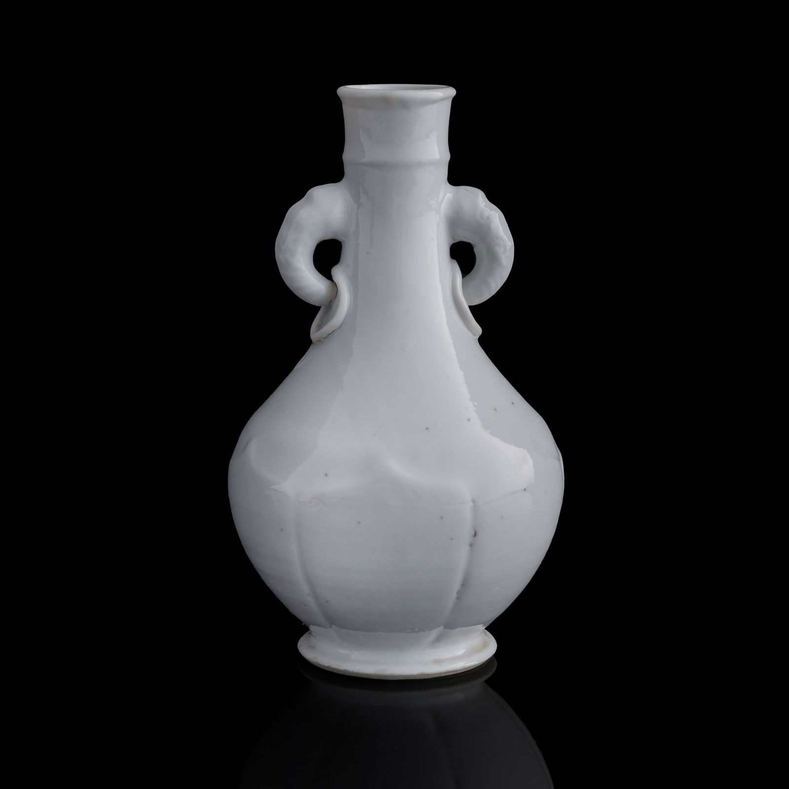 A Chinese white-glazed double-handled vase, Qing dynasty (1 of 7)