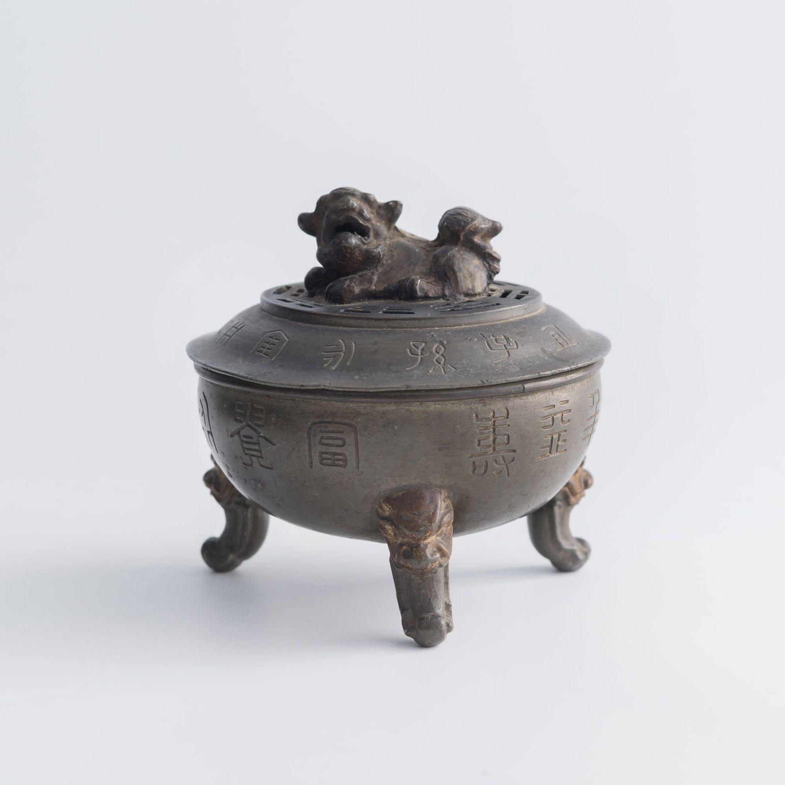 A Chinese pewter censer with archaistic seal script and lion finial, late 19th century (1 of 10)