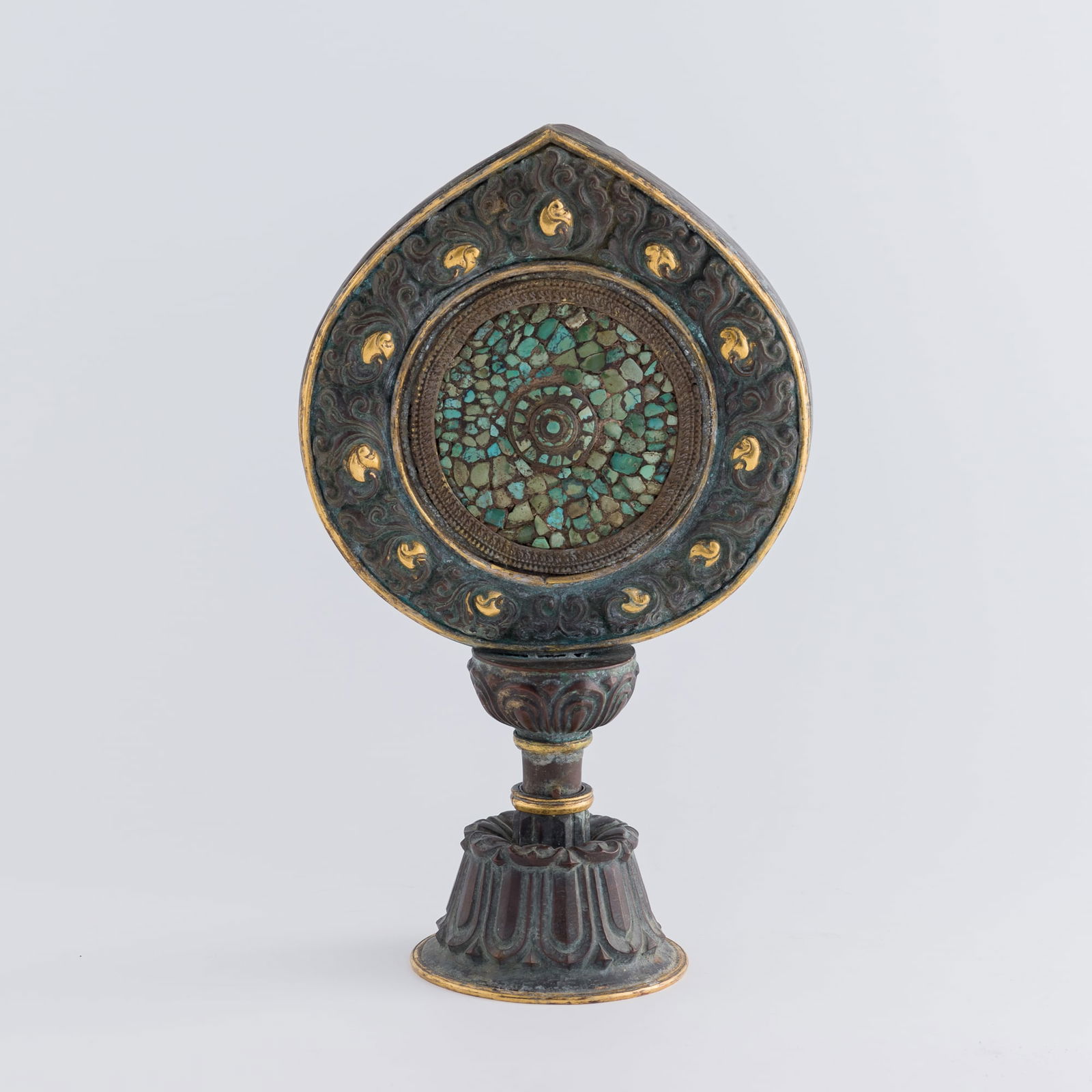 A copper-alloy turquoise-inlaid Wheel of the Law, 19th century (1 of 8)