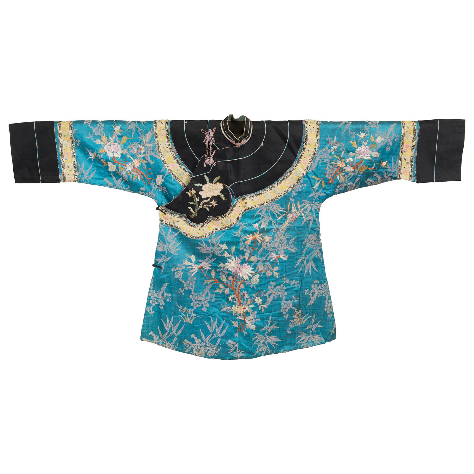 A Chinese blue-ground embroidered 'floral' lady's coat, 19th century (1 of 5)