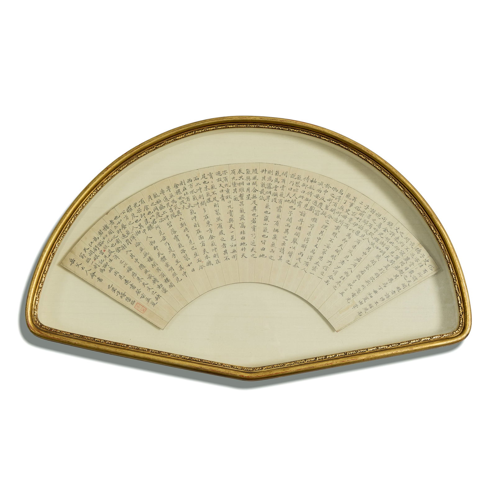 A Chinese calligraphy fan: A Chinese calligraphy fanmatted and framed.Sight dimensions: H: 6 1/2, W: 20 1/2 in. (H: 16.5, W: 52.1 cm.)Overall dimensions: H: 14 1/8, W: 23 1/2 in. (H: 35.9, W: 59.7 cm.)Private collection,