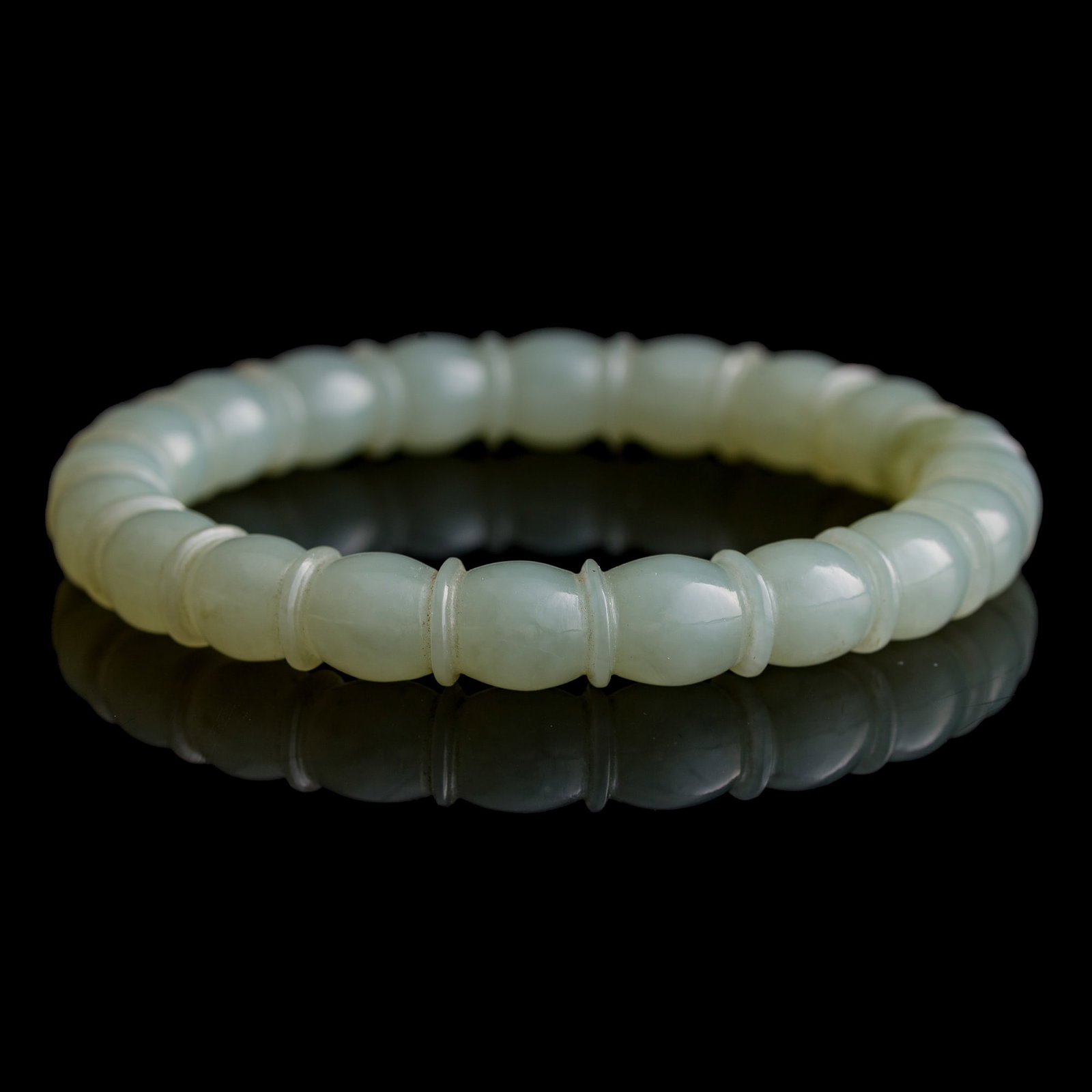 A Chinese white jade lotus-root-form bangle, 18th century: A Chinese white jade lotus-root-form bangle 18th century Ext. Dia: 3, Int. Dia: 2 1/4 in. (Ext. Dia: 7.6, Int. Dia: 5.7 cm.) Private collection, Pennsylvania.