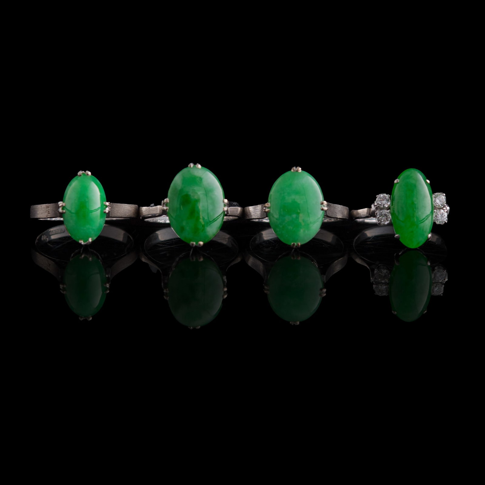 Four Chinese jadeite-set white metal rings, (1 of 13)