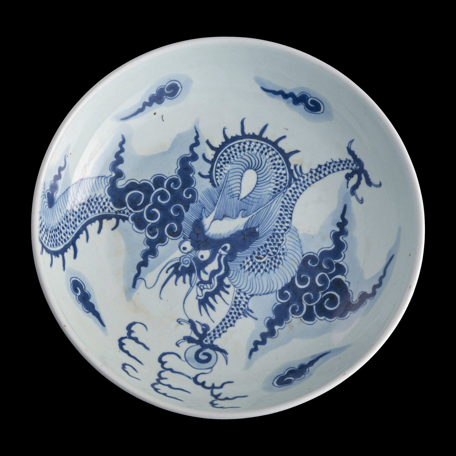A Chinese blue and white 'dragon' plate, Yongzheng period, Qing dynasty: A Chinese blue and white 'dragon' plate Yongzheng period, Qing dynasty H: 2 1/2, Dia: 11 1/4 in. (H: 6.4, Dia: 28.6 cm.) Private collection, Rowland Heights, California. Private collection, Seattle, W
