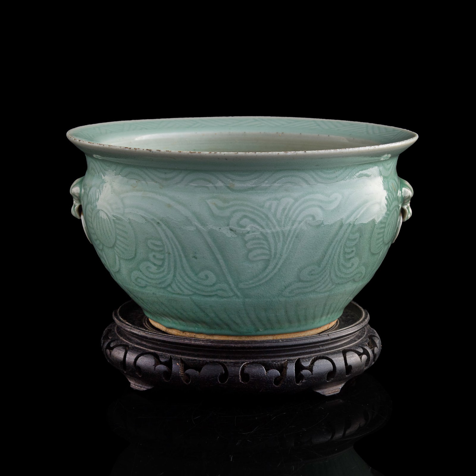 A Chinese celadon-glazed censer, early 19th century: A Chinese celadon-glazed censer early 19th century Sold with associated base. H: 6 1/8, Dia: 11 in. (H: 15.6, Dia: 27.9 cm. (censer)) Private collection, Rowland Heights, California. Private collectio