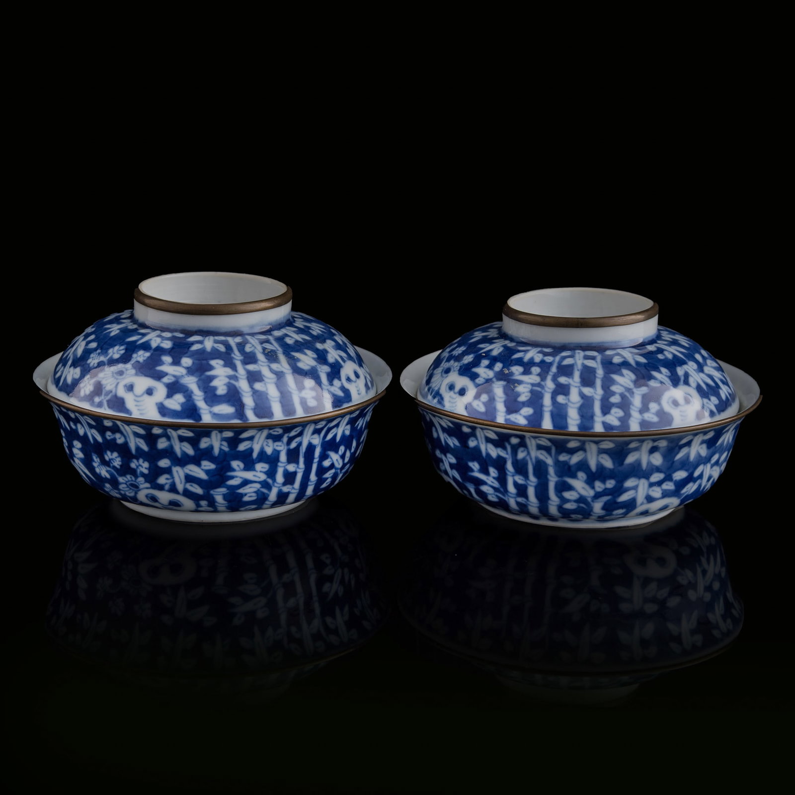 A pair of Chinese blue and white covered bowls, 19th century: A pair of Chinese blue and white covered bowls 19th century Each with four-character mark to knop and bowl underside. (2). H: 2 7/8, Dia: 5 1/4 in. (H: 7.3, Dia: 13.3 cm. (each)) Private collection, M